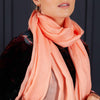 Luxuriously soft merino and silk shawl in coral twill weave with a soft fine fringe generous size light and airy beautifully warm best-quality