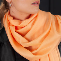 Luxuriously soft merino and silk shawl in peach twill weave with a soft fine fringe generous size light and airy beautifully warm best-quality