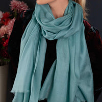 Luxuriously soft merino and silk shawl in duck egg green twill weave with a soft fine fringe generous size light and airy beautifully warm best-quality