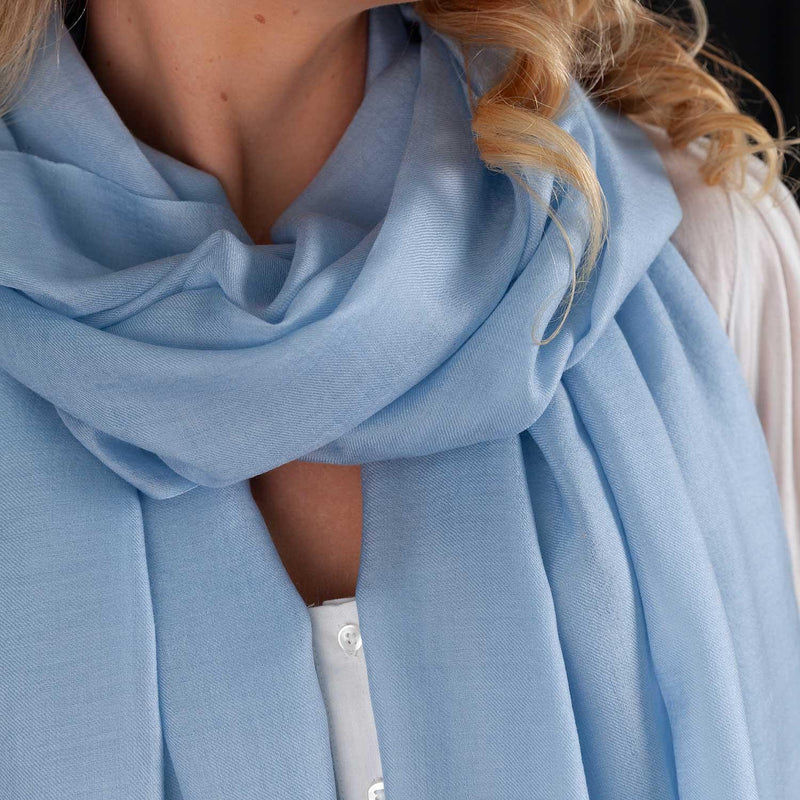 Luxuriously soft merino and silk shawl in light blue twill weave with a soft fine fringe generous size light and airy beautifully warm best-quality