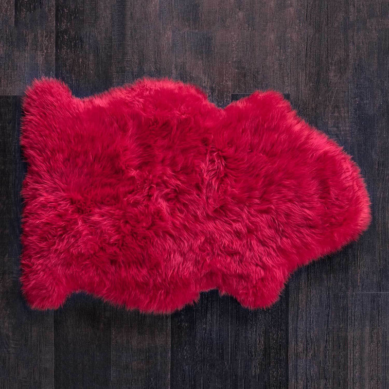 Bright rich Christmas red coloured sheepskin Soft and silky, thick and dense luxurious longwool fleece. From The Wool Company