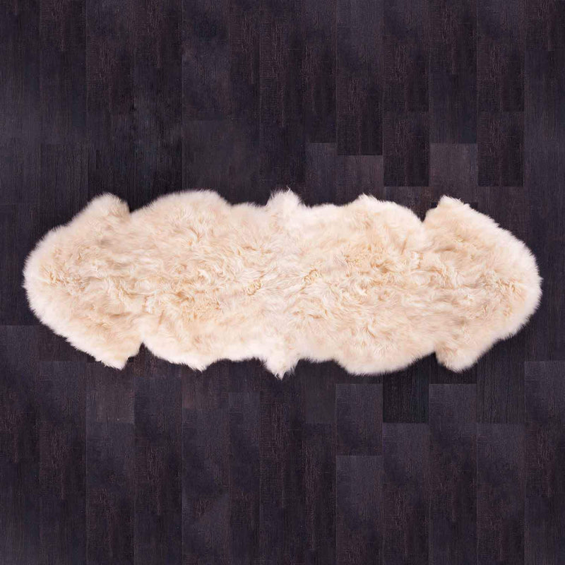 Double sheepskin in a soft rich cream colour silky soft & thick made from two sheepskins sewn together. From The Wool Company