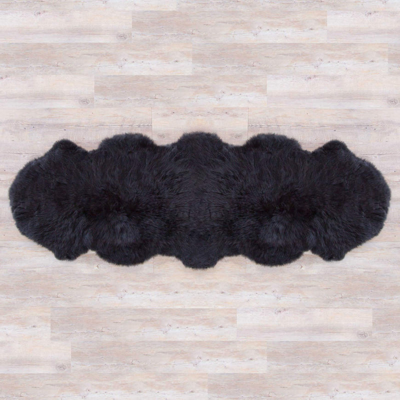 Jet black double sheepskin rug, Silky soft, created from two skins sewn together luxurious and thick. From The Wool Company