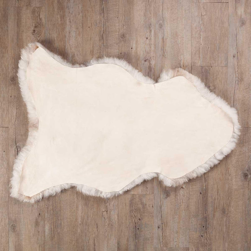 Undyed, shorn Icelandic sheepskin, greys, and browns flecked through a natural white soft fleece, Eco tanned real sheepskin