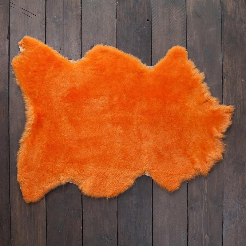 Soft, luxurious sheepskin throw in mandarin orange would look fabulous in any interior shorn fleece, dense & supportive