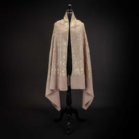 Hand-crafted 100% cashmere pashmina heavily embroidered with gold thread on a neutral background From The Wool Company