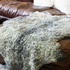 Natural XL sheepskin undyed colour encompassing every shade of grey and cream. luxurious fleece, short, curly, and very soft.