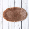 Silky soft, thick, & supportive luxury shorn dyed small sheepskin oval pet bed in attractive colours for a cat or small dog