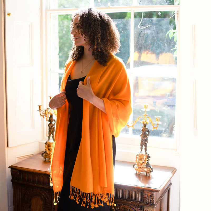 Genuine 100% cashmere pashmina in warm golden orange tones with tasselled fringe super-soft lightweight & warm finest-quality