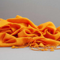 Genuine 100% cashmere pashmina in warm golden orange tones with tasselled fringe super-soft lightweight & warm finest-quality