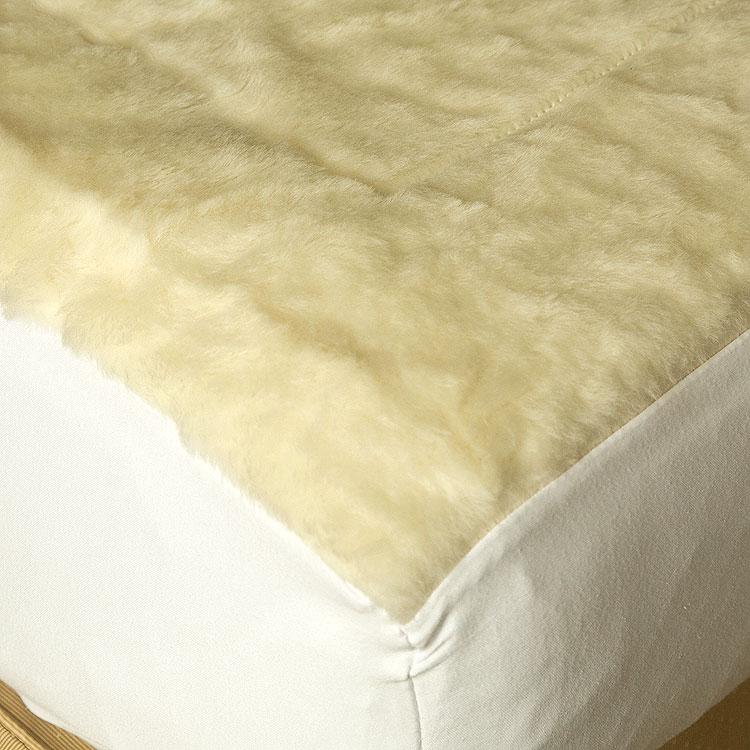 Reversible mattress topper with Merino wool pile with a luxurious lambswool filling.  super-soft, high-quality cotton cover 