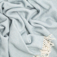 100% pure new wool British-made throw in a soft duck egg blue, fishbone pattern top-quality contemporary subtle colourway